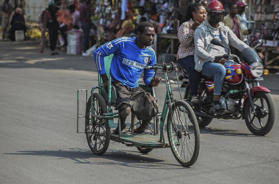 Paul Mitemberezi, a market vendor who has been disabled since he was 3 because of polio, heads to the North Kivu Paralympic League to play basketball, in Goma, democratic Republic of Congo, Tuesday Jan. 17, 2023. When Pope Francis arrives in Congo and South Sudan Jan. 31, thousands of people will take special note of a gesture more grounded than the sign of the cross. Watching from their wheelchairs, they will relate to the way he uses his. (AP Photo/Moses Sawasawa)