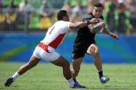 2016 Rio Olympics - Rugby - Preliminary - Men's Pool C New Zealand v Japan - Deodoro Stadium - Rio de Janeiro, Brazil - 09/08/2016. Sonny Bill Williams (NZL) of New Zealand is tackled by Lomano Lava Lemeki (NZL) of Japan. REUTERS/Phil Noble