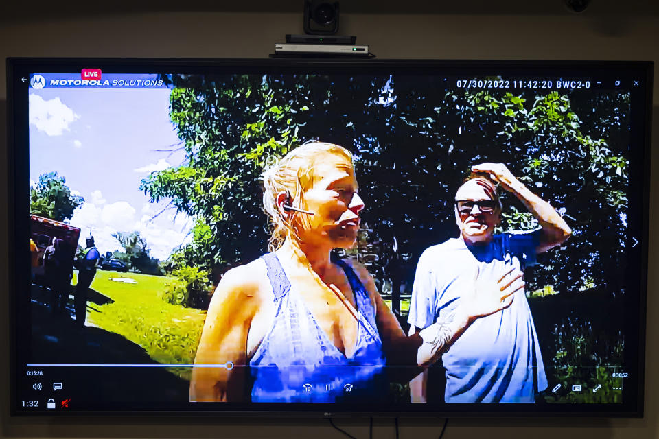 Police body cam footage of Mandy Benn is shown to the court during her preliminary examination on charges of second-degree murder at Ionia County Courthouse in Ionia, Mich., Thursday, Nov. 10, 2022. Benn has been ordered to stand trial on second-degree murder and other charges after five bicyclists were struck by her vehicle this summer as they rode in a charity event. Edward Erickson, 48, of Ann Arbor, and Michael Salhaney, 57, of Bloomfield Hills, were killed. Three other men were hurt. (Joel Bissell/MLive.com/The Grand Rapids Press via AP)