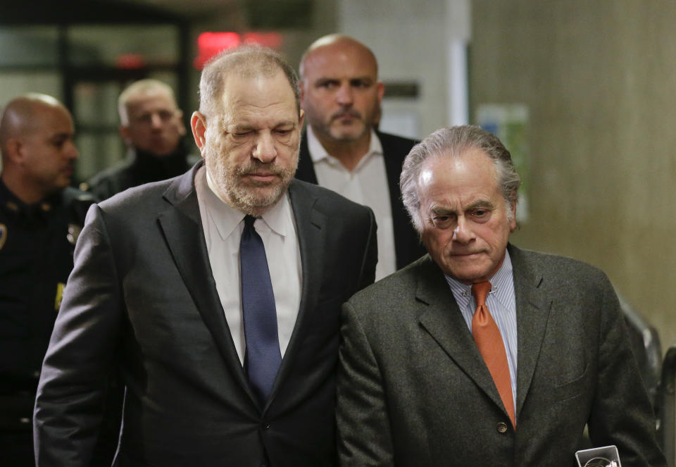 FILE- In this Dec. 20, 2018 file photo, Harvey Weinstein, left, arrives at New York Supreme Court with his attorney Benjamin Brafman in New York. Brafman filed court papers on Thursday, Jan. 17, 2019, asking to withdraw as Weinstein's lawyer. The high-profile criminal defense lawyer is leaving the movie producer's rape case weeks after failing to get the charges dismissed. (AP Photo/Seth Wenig, File)