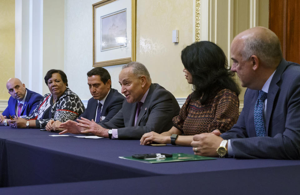 Senate Majority Leader Chuck Schumer, D-N.Y., is flanked by Texas Rep. Trey Martinez Fischer of San Antonio, left, and Texas Sen. Carol Alvarado of Houston, as he meets with Texas Democratic lawmakers to discuss voting rights, at the Capitol in Washington, Tuesday, June 15, 2021. Two weeks ago the Democrats walked out of the Texas House of Representatives to block passage of a new restrictive voting law. (AP Photo/J. Scott Applewhite) .