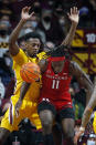 Rutgers center Cliff Omoruyi (11) loses the ball as Minnesota forward Charlie Daniels (15) defends him in the first half of an NCAA college basketball game Saturday, Jan. 22, 2022, in Minneapolis. (AP Photo/Bruce Kluckhohn)