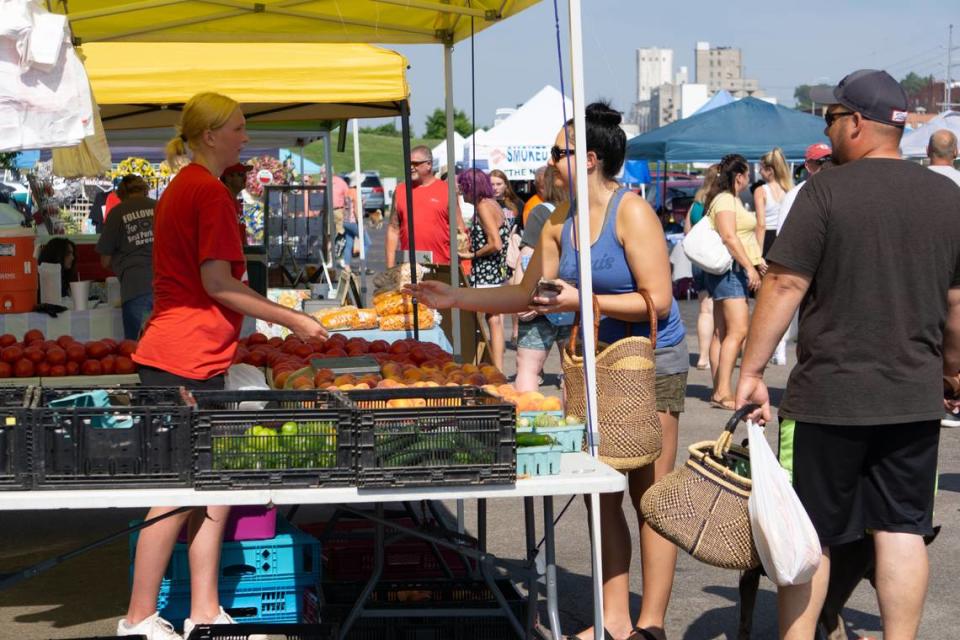 Farmers markets continue to take place weekly throughout the metro-east. Pictured: Vendors and customers at the Alton Farmers’ & Artisans’ Market in 2022