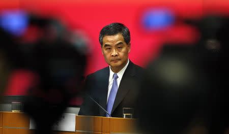 Hong Kong Chief Executive Leung Chun-ying looks on in between video cameras during a news conference in Hong Kong in this July 15, 2014 file photo. REUTERS/Bobby Yip/Files