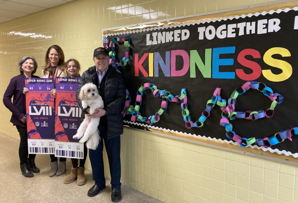 Palmyra-Macedon eighth-grader Daisy Jones and her mom, Principal Darcy Smith, are headed to the Super Bowl on Saturday after Daisy won a video contest promoting kindness. Smith and Daisy are flanked by Susan and Stuart Muszynski (holding Bailey) from the Values-In-Action Foundation.