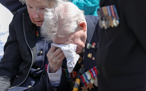 D-Day veteran Jimmy Ockendon wipes away tears during service - Credit: Andrew Matthews/PA