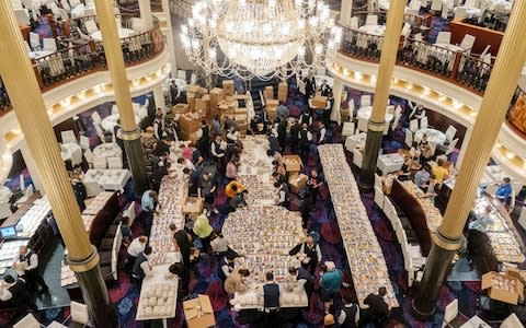 Crewmembers from Royal Caribbean's Mariner of the Seas cruise ship pack food - Credit: Cristobal Herrera/Rex