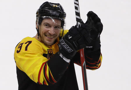 Ice Hockey - Pyeongchang 2018 Winter Olympics - Men's Quarterfinal Match - Sweden v Germany - Kwandong Hockey Centre, Gangneung, South Korea - February 21, 2018 - Patrick Reimer of Germany celebrates at the end of the match. REUTERS/Kim Kyung-Hoon