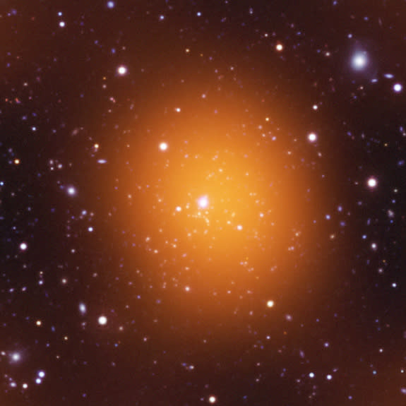 Microwave (orange), optical (red, green, blue) and ultraviolet (blue) image of Phoenix Cluster.