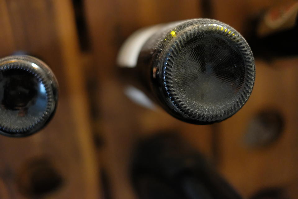 Bottom view of two hanging microphones against a blurred background