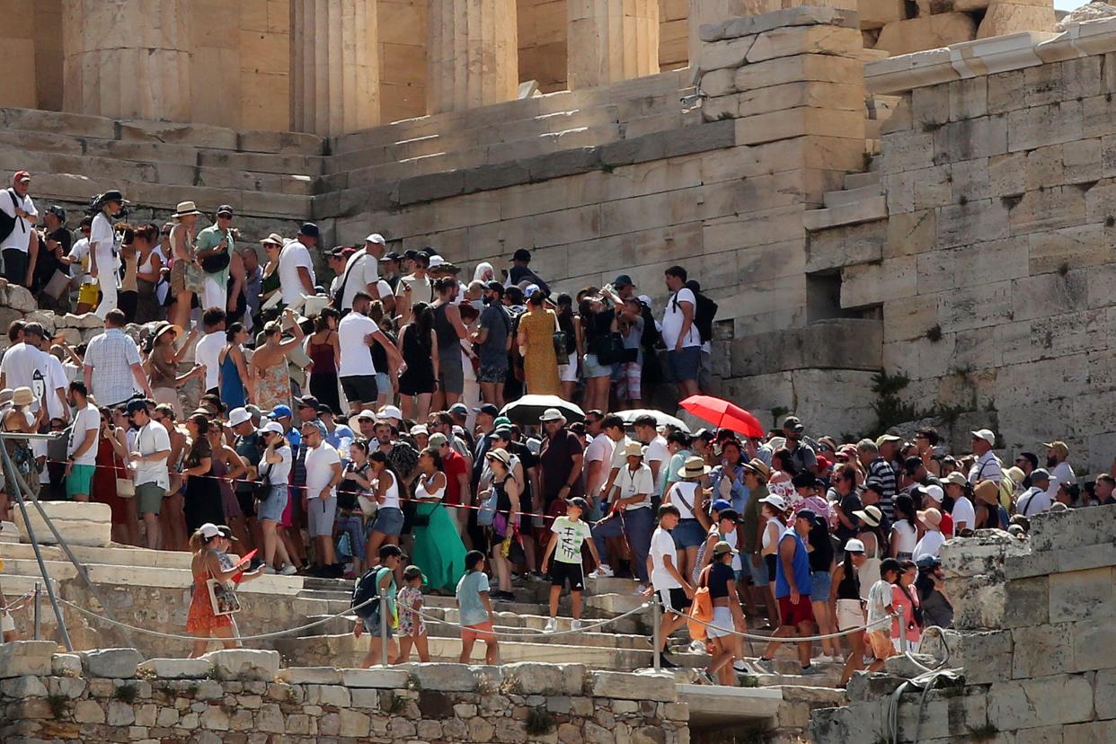 Tourists were forced to leave the Acropolis in Athens, Greece, which closed at midday today due to high temperatures (EPA)