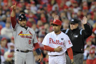 PHILADELPHIA, PA - OCTOBER 02: Albert Pujols #5 of the St. Louis Cardinals signals to his team after advancing on a single by Lance Berkman #12 in the seventh inning of Game Two of the National League Division Series against the Philadelphia Phillies at Citizens Bank Park on October 2, 2011 in Philadelphia, Pennsylvania. (Photo by Drew Hallowell/Getty Images)