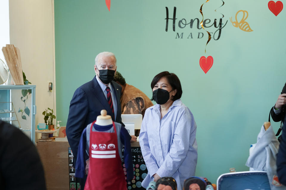 President Joe Biden talks with Honey Made store owner Viboonrattana "Moo" Honey as he visits the store in Washington, Tuesday, Jan. 25, 2022. (AP Photo/Andrew Harnik)