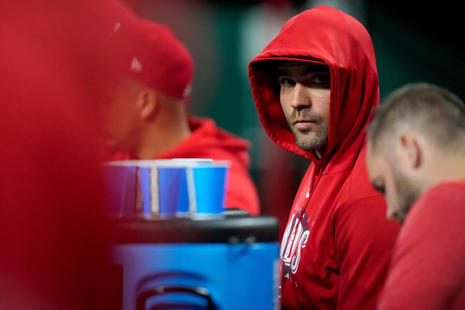 Injured Cincinnati Reds first baseman Joey Votto (19) walks discreetly though the dugout in the eighth inning of the MLB Interleague game between the Cincinnati Reds and the Chicago White Sox at Great American Ball Park in downtown Cincinnati on Friday, May 5, 2023. The Reds lost the opening game of the series, 5-4.