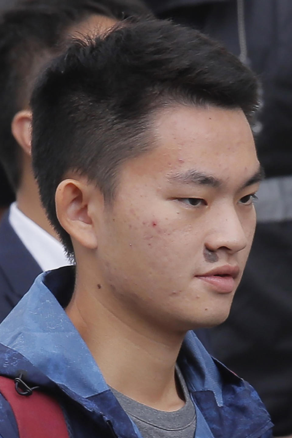 Chan Tong-kai, talks to the media as he is released from prison in Hong Kong Wednesday, Oct. 23, 2019. Chan, who's wanted for killing his girlfriend last year on the self-ruled island, had asked the Hong Kong government for help turning himself in to Taiwan after his sentence for money laundering offenses ends on Wednesday. (AP Photo/Kin Cheung)