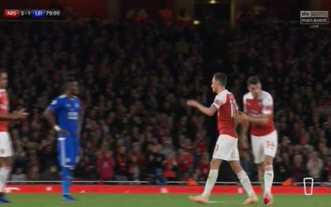 Ozil comes off, he gives the captain's armband to Xhaka - Credit: Sky