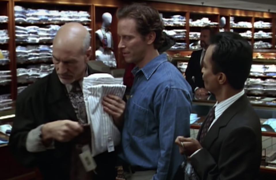 Actors Patrick Stewart and Steven Weber shop in the men's section of a store with a sales associate.