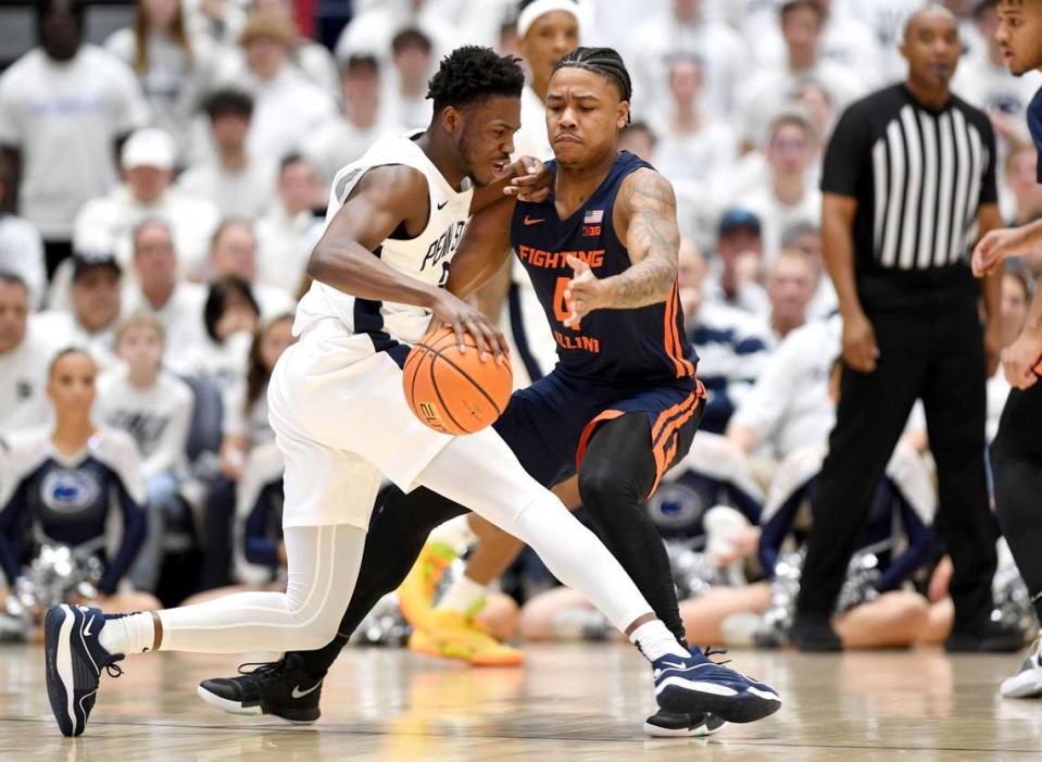 Penn State’s D’Marco Dunn pushes around Illinois Justin Harmon during the game on Wednesday, Feb. 21, 2024 at Rec Hall.