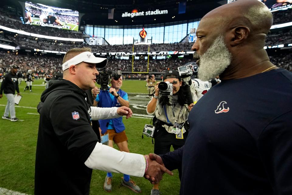 Las Vegas Raiders head coach Josh McDaniels, left, greets Houston Texans head coach Lovie Smith after the Raiders defeated the Texans 38-20 in an NFL football game Sunday, Oct. 23, 2022, in Las Vegas. (AP Photo/John Locher)