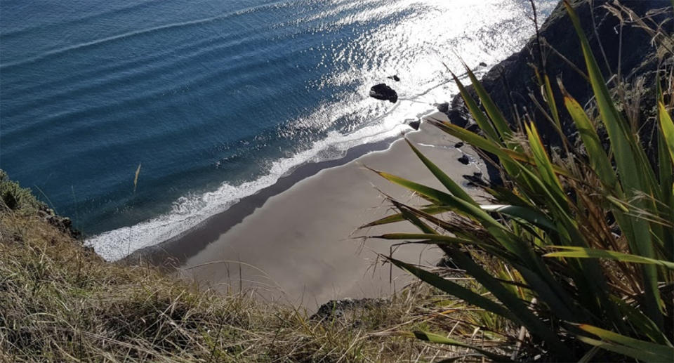 Mercer Bay beach is photographed from the top of one of the cliffs surrounding the beach.