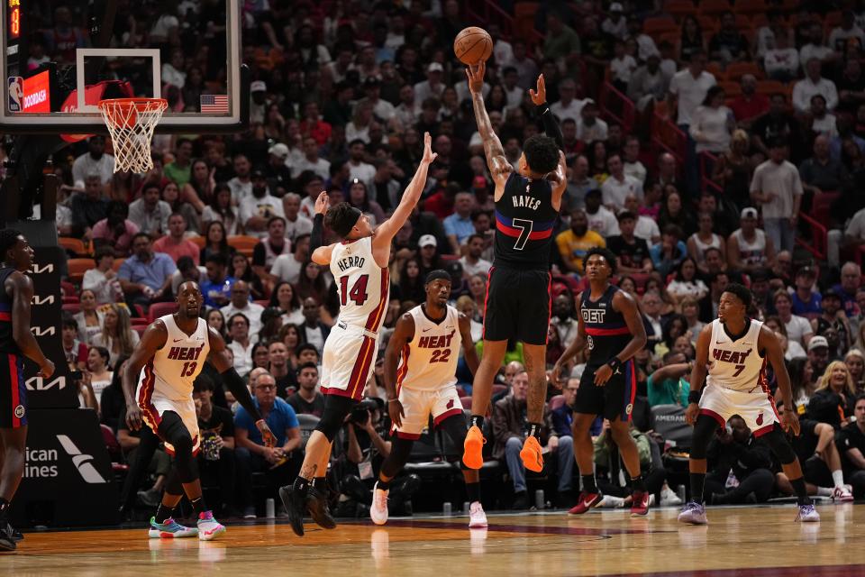 Pistons guard Killian Hayes shoots the ball over Heat guard Tyler Herro in Miami on Oct. 25, 2023.