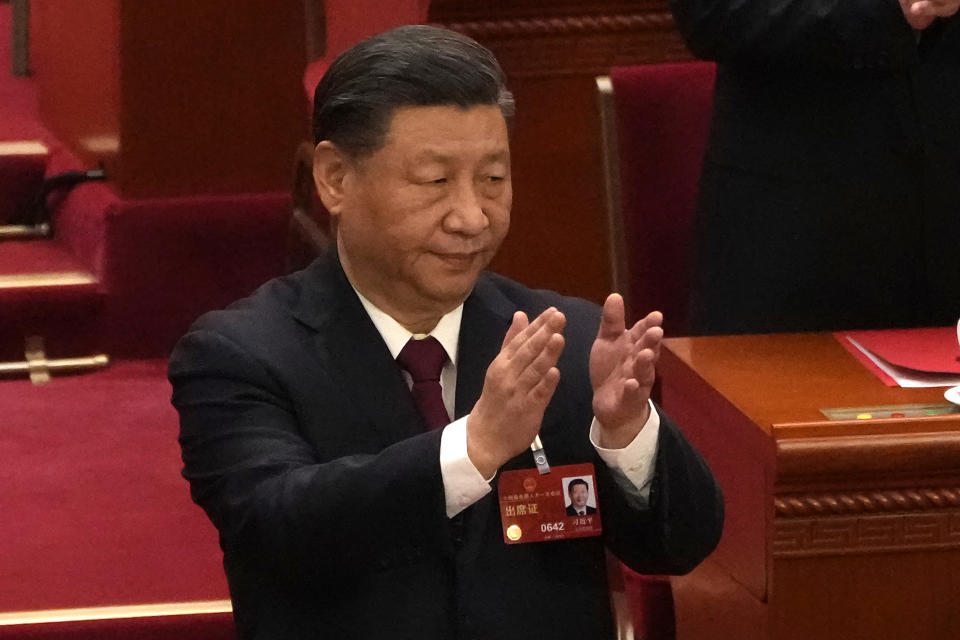 Chinese President Xi Jinping applauds at the closing ceremony for China's National People's Congress (NPC) at the Great Hall of the People in Beijing, Monday, March 13, 2023. (AP Photo/Andy Wong)
