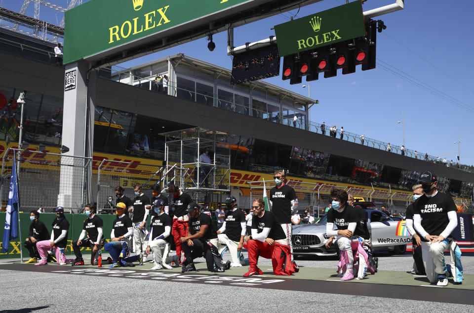 Drivers take a knee in support of the Black Lives Matter movement before the Austrian Formula One Grand Prix race at the Red Bull Ring racetrack in Spielberg, Austria, Sunday, July 5, 2020. (Dan Istitene/Pool via AP)