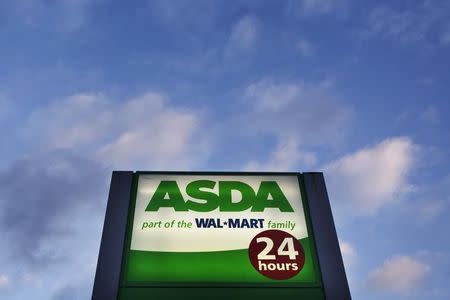 File photo of a sign for the ASDA supermarket chain stands outside a store in London, January 23, 2012. REUTERS/Finbarr O'Reilly (BRITAIN - Tags: BUSINESS FOOD) - RTR2WQCU