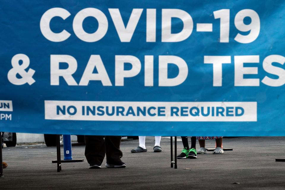 People wait to get tested for COVID-19 at a pop-up testing site in Los Angeles, Monday, Dec. 20, 2021. Omicron has raced ahead of other variants and is now the dominant version of the coronavirus in the U.S., accounting for 73% of new infections last week, federal health officials said Monday. (AP Photo/Jae C. Hong)