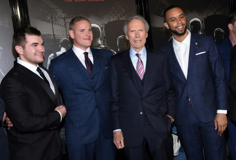 Train attack heroes Alek Skarlatos, Spencer Stone and Anthony Sadler pose with Clint Eastwood outside the world premiere of "The 15:17 to Paris" in California