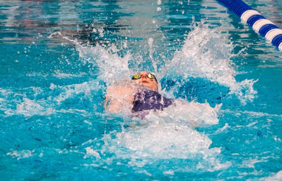 State College Area High School senior Jade Castro surfaces for air during the Girls 100 Yard Backstroke in the AAA Bracket during the PIAA Swimming and Diving 2023 District 6 Championship held at the McCoy Natatorium on Saturday, March 4, 2023, in University Park, Pa. Castro placed first in her event with a final time of 0:55.16.