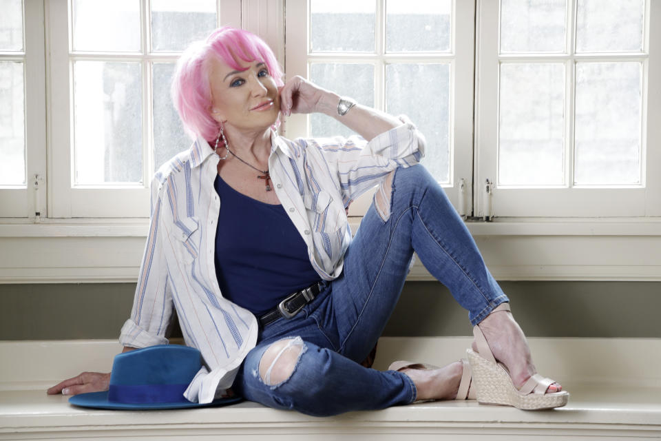 In this Aug. 20, 2019, photo, Tanya Tucker sits for a portrait session in Nashville, Tenn., to promote her new album, “While I’m Livin’, ” out on Friday, (AP Photo/Mark Humphrey)