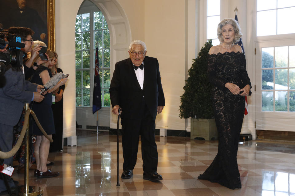 Former Secretary of State Henry Kissinger, left, and wife Nancy Kissinger arrive for a State Dinner with Australian Prime Minister Scott Morrison and President Donald Trump at the White House, Friday, Sept. 20, 2019, in Washington. (AP Photo/Patrick Semansky)
