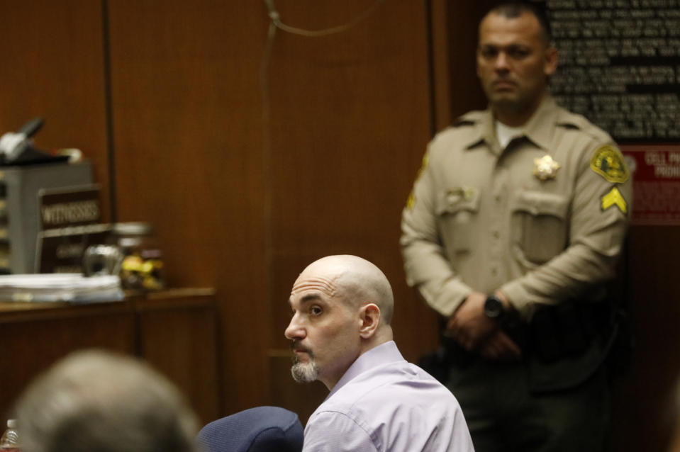 CORRECTS FIRST NAME OF WITNESS TO ASHTON INSTEAD OF AUSTIN - FILE - In this May 29, 2019, file photo, Michael Gargiulo listens to the testimony of actor Ashton Kutcher during Gargiulo's murder trial at Los Angeles Superior Court. Gargiulo has pleaded not guilty to two counts of murder and an attempted-murder charge stemming from attacks in the Los Angeles area between 2001 and 2008, including the death of Kutcher's former girlfriend, 22-year-old Ashley Ellerin. A judge is expected to give a death sentence Friday, Feb. 28, 2020. (Genaro Molina/Los Angeles Times via AP, Pool, File)