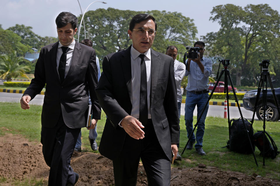 Gohar Khan, center, a lawyer of Pakistan's former Prime Minister Imran Khan's legal team, arrives at a court to file petition against Khan's conviction, in Islamabad, Pakistan, Tuesday, Aug. 8, 2023. The lawyers for Khan petitioned a top court in the capital, Islamabad, on Tuesday, seeking the suspension of his conviction and sentencing of three years in jail in a graft case and requesting his release, a spokesman for the former premier's legal team said. (AP Photo/Anjum Naveed)