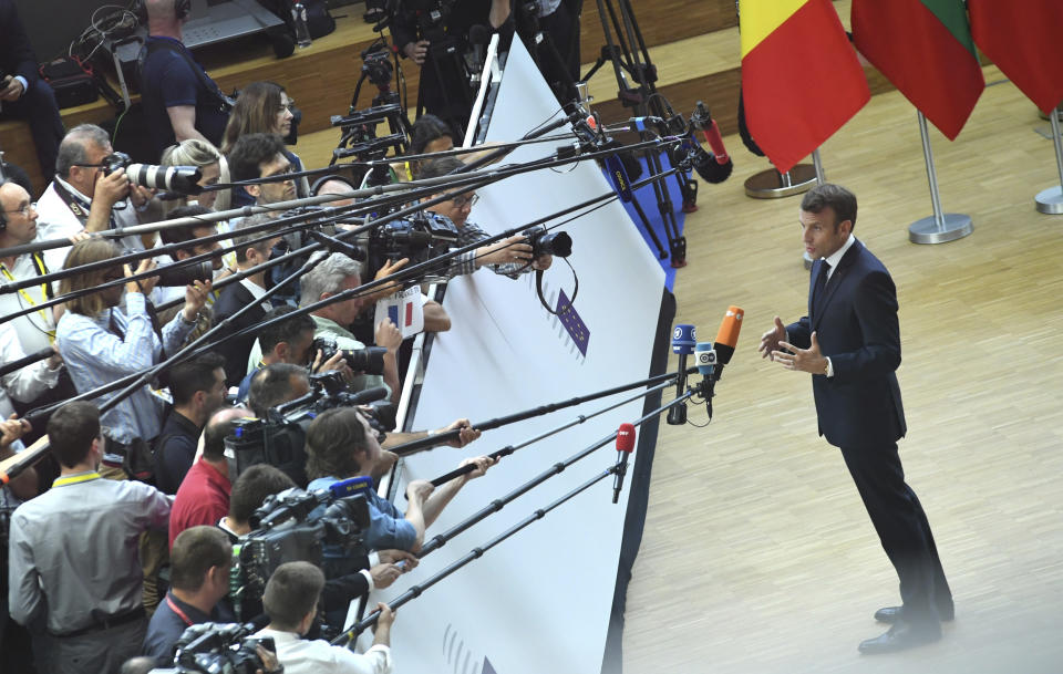 French President Emmanuel Macron arrives for an EU summit in Brussels, Sunday, June 30, 2019. European Union leaders have started another marathon session of talks desperately seeking a breakthrough in a diplomatic fight over who should be picked for a half dozen of jobs at the top of EU institutions. (AP Photo/Riccardo Pareggiani)