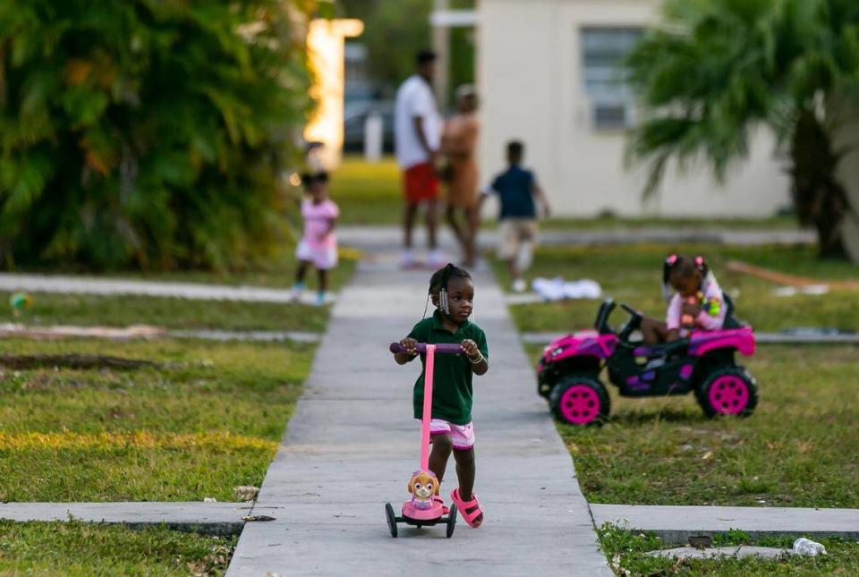 Children play at the Kingsway Apartments neighborhood in Coconut Grove on Monday, February 8, 2021.