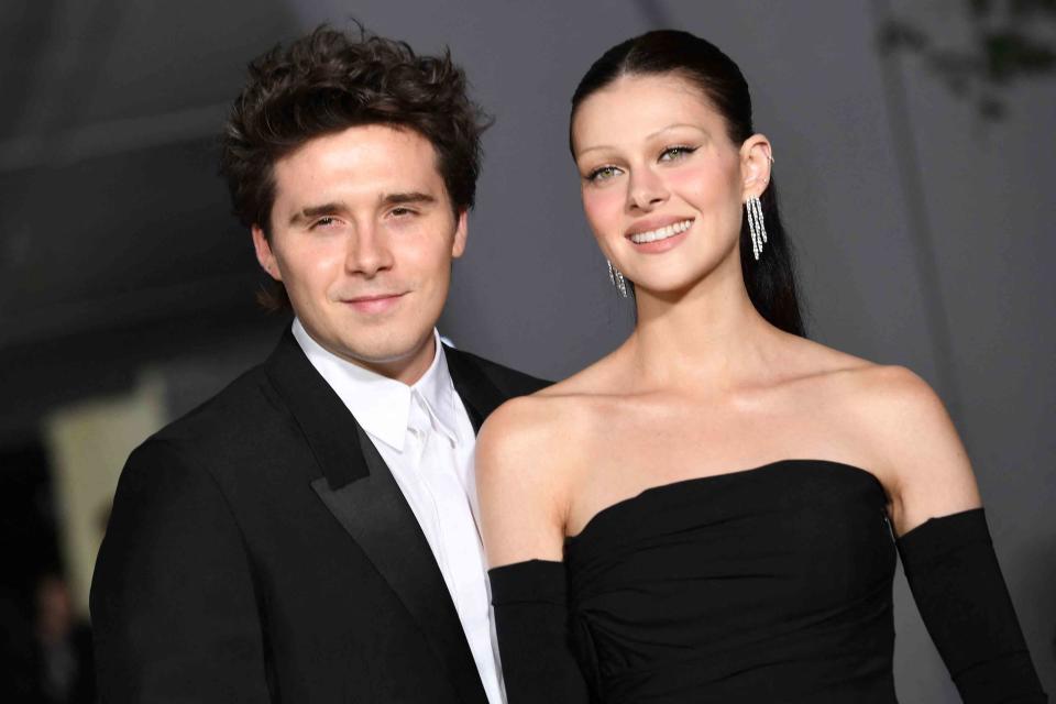 <p>VALERIE MACON/AFP via Getty </p> Brooklyn Beckham and wife Nicola Peltz attend the Second Annual Academy Museum Gala on October 15, 2022.