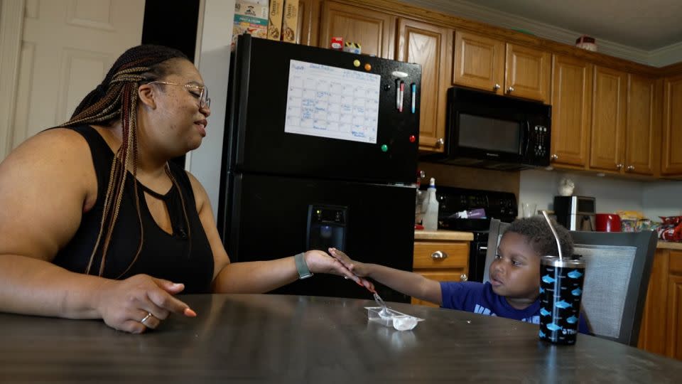 Tonya Dixon plays with her son, Lukas, who was born prematurely at UAMS in 2019. - CNN