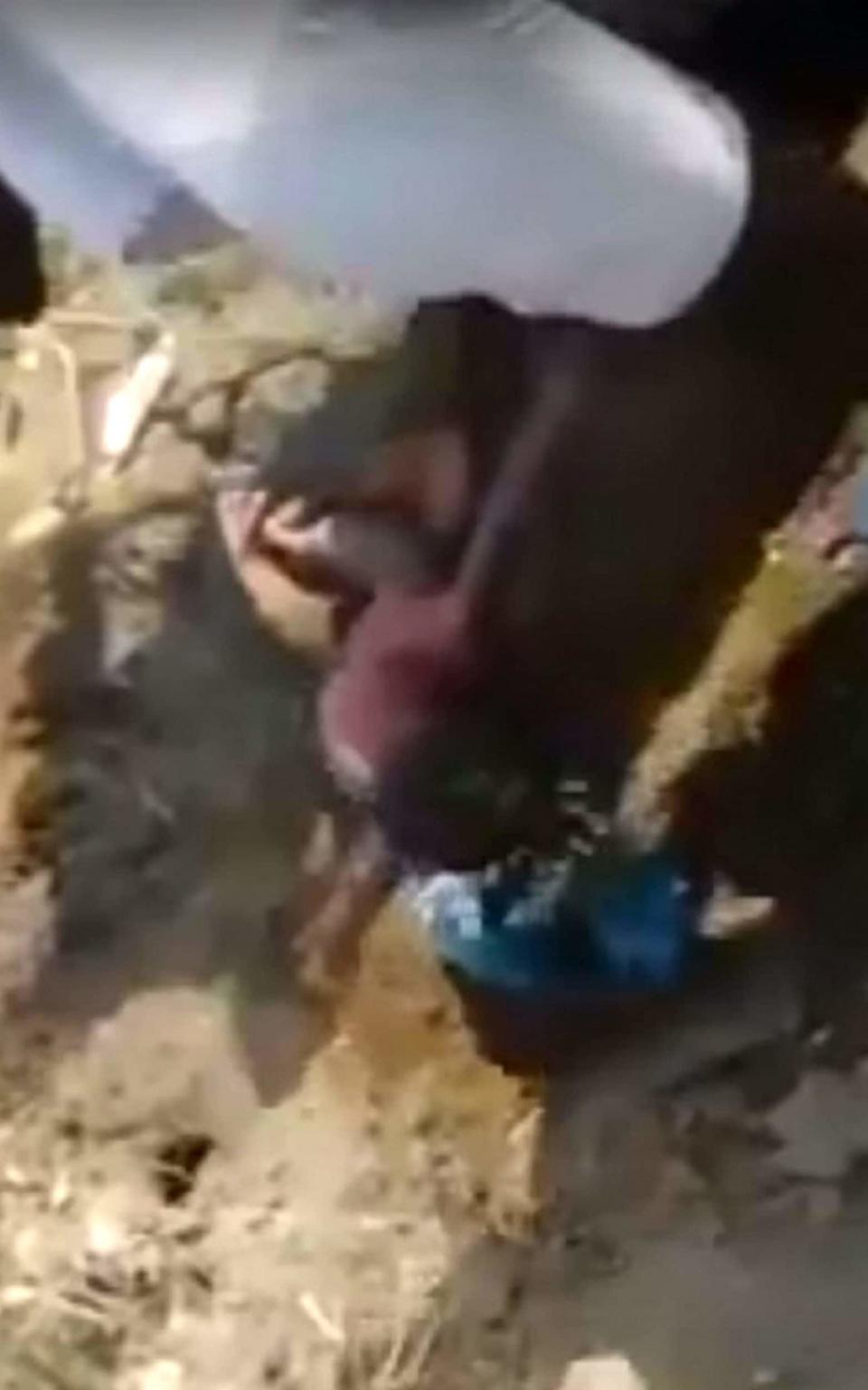 The child - between just four and six hours old - was found after a schoolgirl spotted her feet poking through ground in a field. - Credit: SWNS.com 