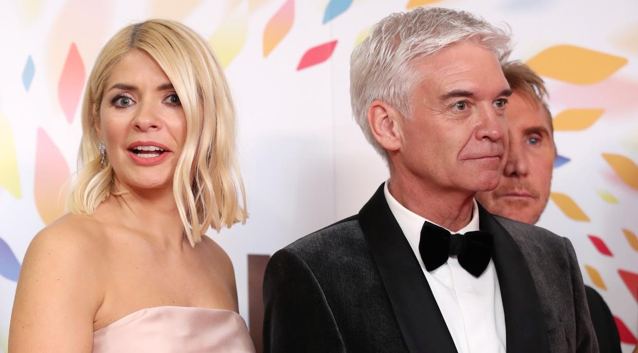 Holly Willoughby and Phillip Schofield tried to keep calm and carry on when a fire alarm went off in the 'This Morning' studio. (Getty Images)