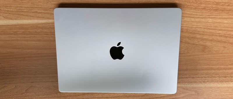 MacBook Pro closed on a wooden desk