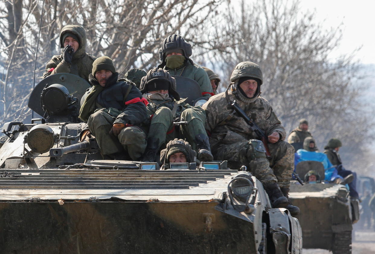 An armoured convoy of pro-Russian troops is seen outside the separatist-controlled town of Volnovakha in the Donetsk region, Ukraine. (Reuters)