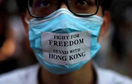 Masked anti-government protesters gather in Central Hong Kong