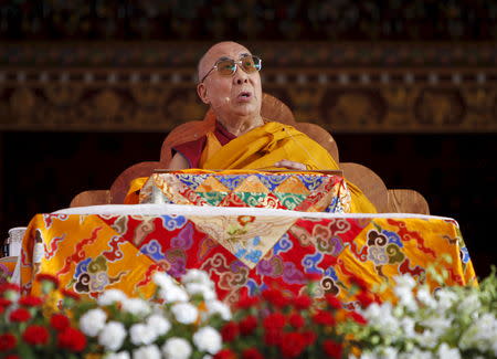 Tibetan spiritual leader the Dalai Lama pauses as he delivers the Jangchup Lamrim teachings at the Tashi Lhunpo Monastery in Bylakuppe in Karnataka, India, in this December 25, 2015 file photo. REUTERS/Abhishek N. Chinnappa/Files