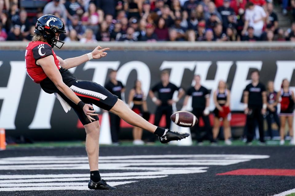 Cincinnati Bearcats punter Mason Fletcher (31) punts in the fourth quarter of a college football game against the Indiana Hoosiers, Saturday, Sept. 24, 2022, at Nippert Stadium in Cincinnati. 