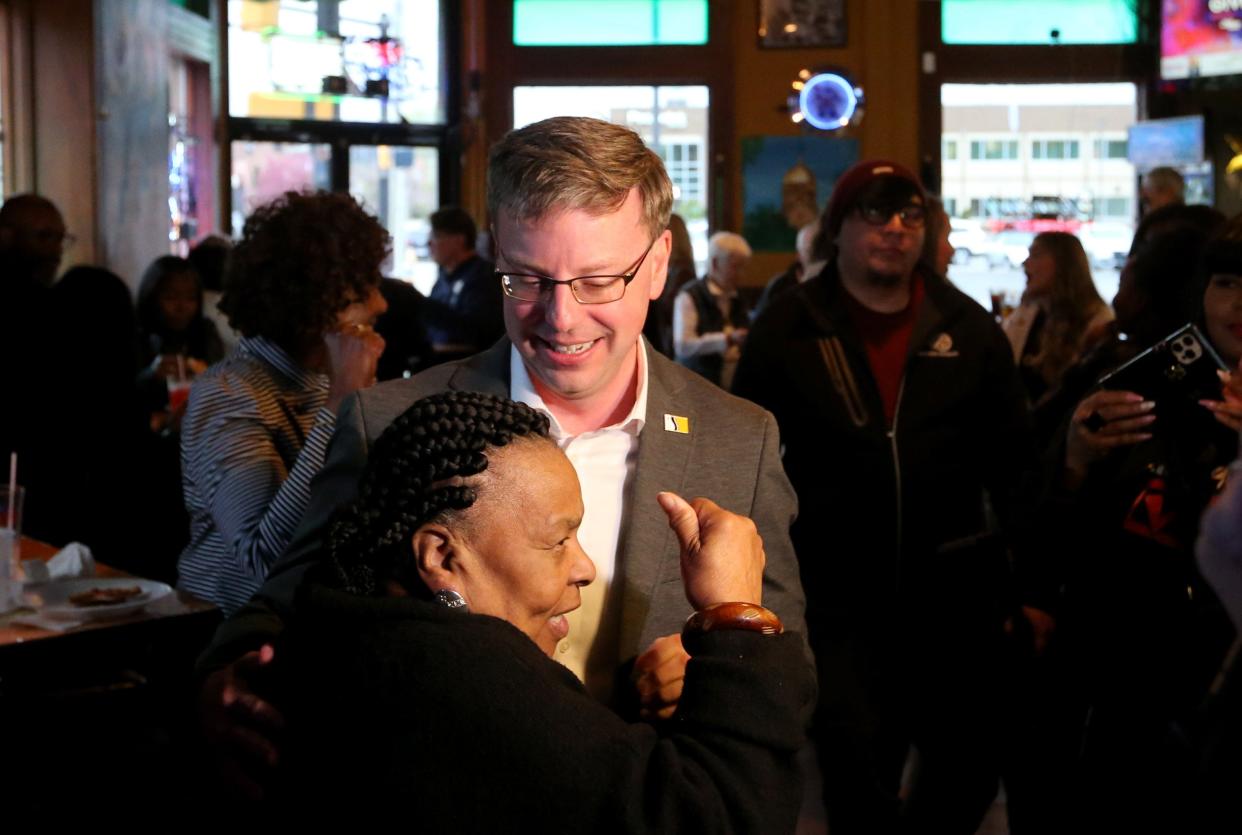 Mayor James Mueller speaks with Gladys Muhammad Tuesday, May 2, 2023, at Corby’s in South Bend for the 2023 primary election. Mueller won the Democratic primary for another run for South Bend Mayor over Henry Davis Jr.