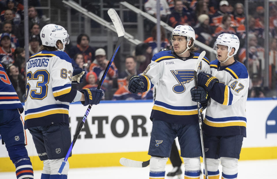 St. Louis Blues' Jake Neighbours (63), Robert Thomas (18) and Torey Krug (47) celebrate a goal against the Edmonton Oilers during the first period of an NHL hockey game Wednesday, Feb. 28, 2024, in Edmonton, Alberta. (Jason Branson/The Canadian Press via AP)