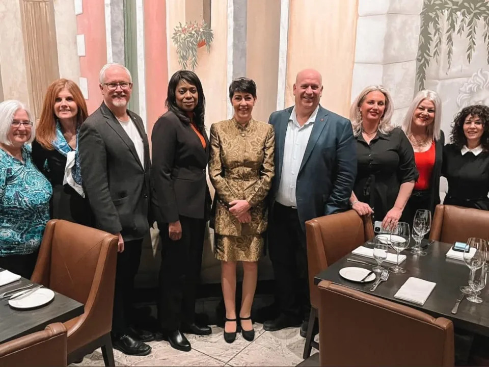 German politician Christine Anderson, centre, poses with a group that includes Niagara West MP Dean Allison (fourth from right), Oshawa MP Colin Carrie (third from left) and Haldimand–Norfolk MP Leslyn Lewis (fourth from left). (Twitter - image credit)