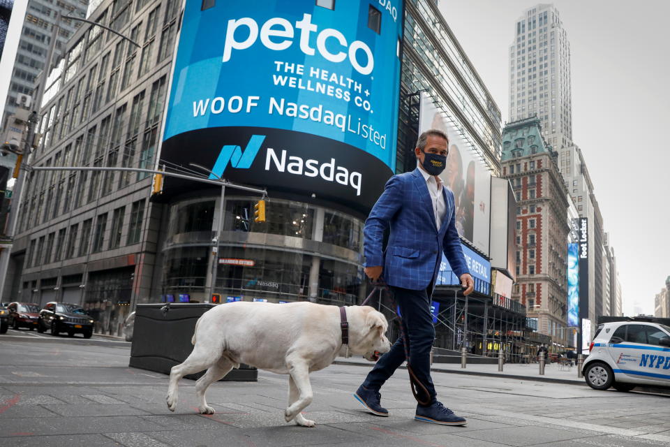 Ron Coughlin, CEO of Petco Health and Wellness Company Inc., walks with his dog Yummy during the company's IPO at the Nasdaq Market Site in Times Square in New York City, U.S., January 14, 2021.  REUTERS/Brendan McDermid